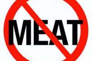 A logo of no entry with word meat to show support for vegatarianisms